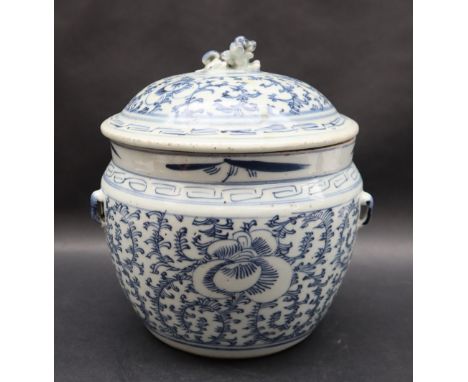 A Chinese porcelain pot and cover, the domed lid with lion dog finial, overall decorated with scrolling leaves, 22cm high  CO