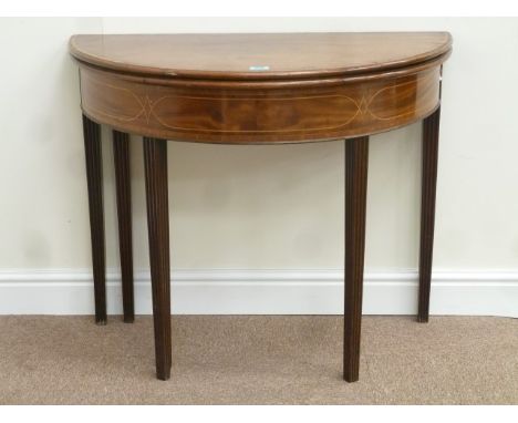 George III mahogany demi lune card table, inlaid with box wood stringing and crossbanded in Kingwood, foldover baize lined to