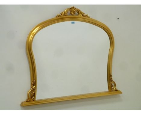 Arch top overmantle mirror in gilt frame with carved pediment, W127cm x H100cm overall