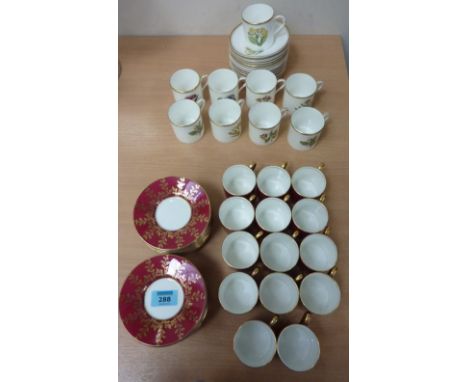 Royal Worcester coffee cans and saucers with floral decoration and Aynsley burgundy and gilt coffee cans and saucers