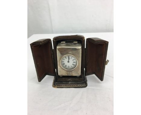 A cased HM silver carriage clock