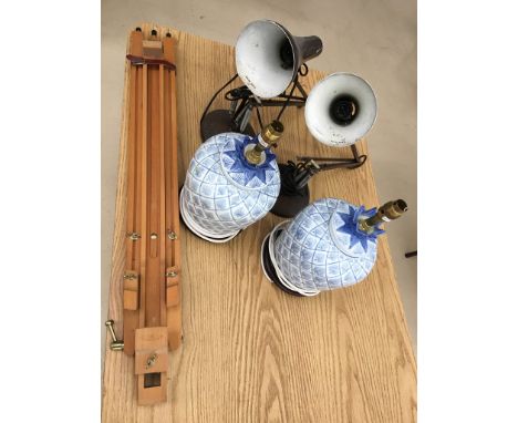 A pair of angle poise lamps; together with ceramic lamps and an easel