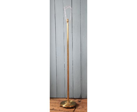 A brass standard lamp, with floral detailing; and a gilt brass and earthenware table lamp, 130cm & 44cm (2)