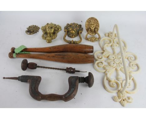 A wicker picnic hamper; two turned beech juggling clubs; four brass door knockers; a cast iron towel rail etc (qty)