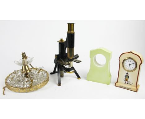 A Charles Dickens Bill Sykes mantel timepiece, 17cm; a Mr Pickwick timepiece holder; a lacquered brass microscope; a ceiling 
