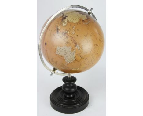 A globe with silvered metal meridian, on turned and ebonised wooden base, 51.5cm high 