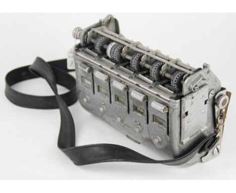 A 1960's bus conductor's ticket machine with five reels and attached strap, 23cm wide 