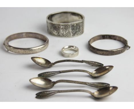 A Victorian silver hinged bangle, Birmingham 1882, half engraved with birds, ivy and foliage, along with two further silver h