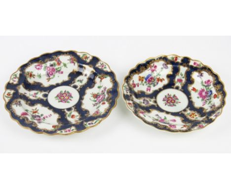 Two 18th century first period Worcester porcelain plates, both painted with reserves of flowers in the manner of Giles, again