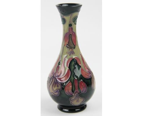 A Moorcroft Fushcia pattern vase, with everted rim and botanical tube lined design on a green ground, impressed and painted t