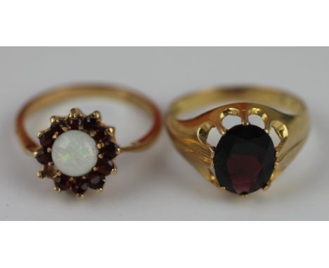 A garnet set 9ct yellow gold signet ring, weight 3gms along with a garnet and opal set cluster ring, also set in 9ct yellow g