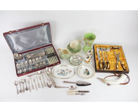 A cased carving set, a collection of French silver plated cutlery, within a fitted case, a silver and mother of pearl handled