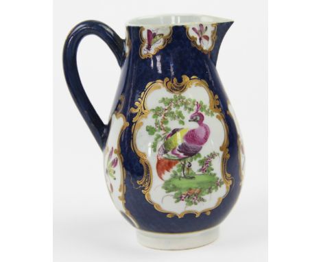 An 18th century first period Worcester porcelain sparrow beak jug, decoreted with flowers against a blue scale ground, Callow