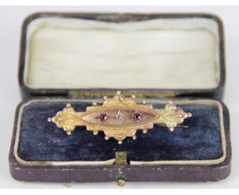 An Edwardian ruby and diamond 9ct yellow gold mourning/love token brooch, Chester 1903, the filligree and bead bar brooch set