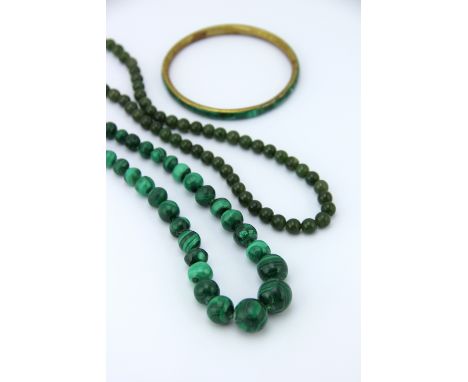 A single strand, graduated malachite bead necklace, 42.5cm long a jade bead necklace; a malachite set bangle; A mourning lock