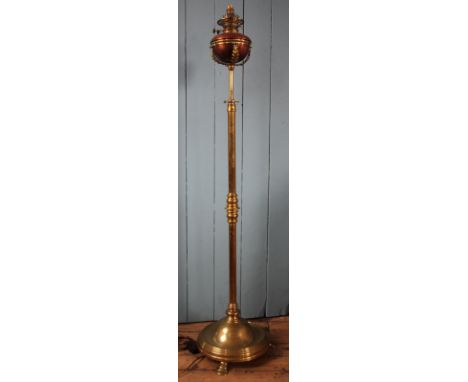 A Victorian copper and brass Arts and Crafts adjustable standard lamp, with circular column and base with splayed feet, 153cm