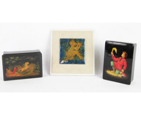 Two Russian lacquered boxes, one decorated with a boy with a flaming feather, the other with a figure and a horse, 15.5cm; wi