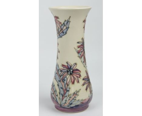 A Moorcroft Cornflower pattern vase, with pastel pink/blue cornflowers upon a cream ground, of fluted form, impressed and pai