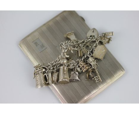 A silver cigarette case, John Rose Birmingham 1945, of typical engine turned design monogrammed 'RM', weight 149gms along wit