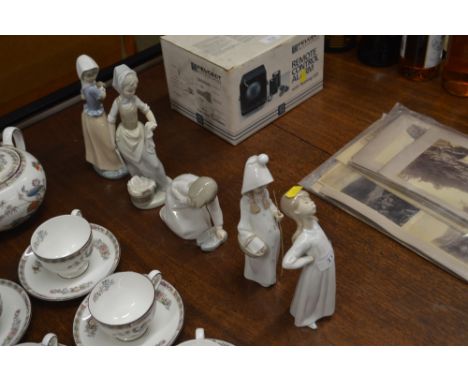 Two Nao figures; and three various Lladro figures