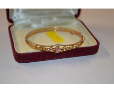 A 9ct gold peridot, amethyst and pearl set bracelet in the Suffragette colours 