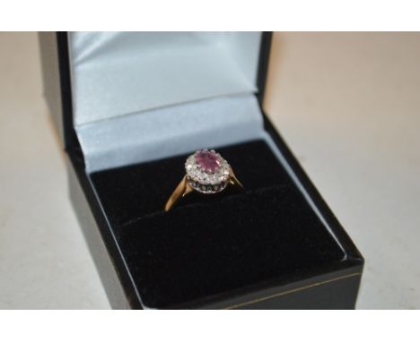 A 9ct gold white stone and ruby set ring 