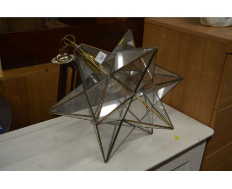 A light fitting in the form of a star  AF