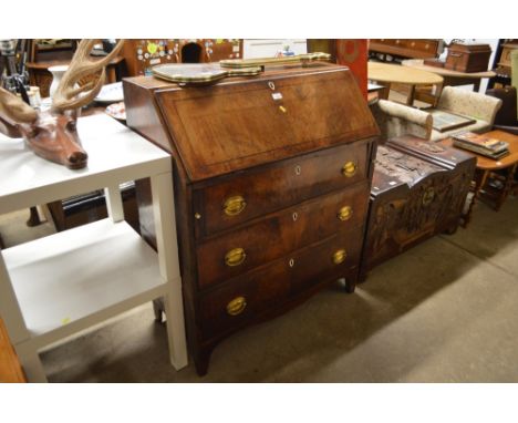 A 19th Century mahogany bureau fitted three long drawers in two parts 
