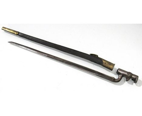 A British 1876 pattern Martini Henry socket bayonet with brass mounted black leather scabbard a/f 