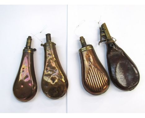 Three copper powder flasks and a brown leather shot flask (4) 