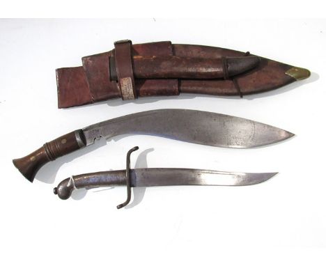 A WWI kukri with accompanying dagger, military issue ordnance marked with W.D. Co I. 1916