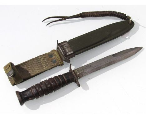 A U.S. Fighting knife, marked U.S. M3-ITICA, with U.S. M8 scabbard 