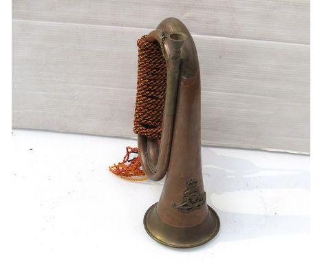 A copper and brass bugle bearing Royal Artillery badge 