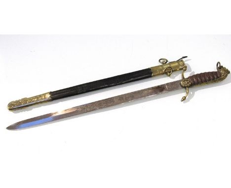 A George V/VI Royal Naval Officer's dirk with lion pommel, ribbed leather grip and brass mounted black leather scabbard