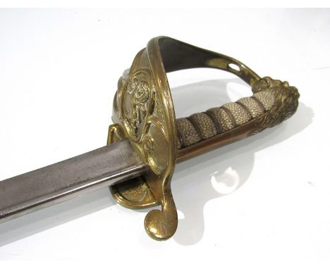 A British 1827 pattern Naval Officer's sword, the lion pommel joined to a rayskin grip, the guard with Honourable East India 