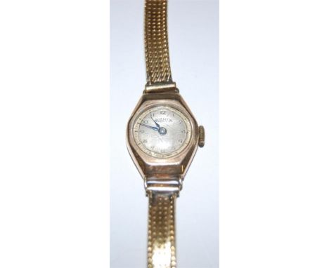 A Roamer 9ct gold ladies wrist watch having manual wind movement and yellow metal bracelet