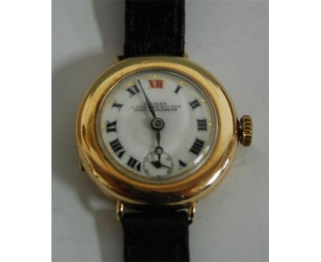 A 15ct gold cased ladies wrist watch with manual wind movement, the dial signed Lexis***the movement signed TAVANNES ***