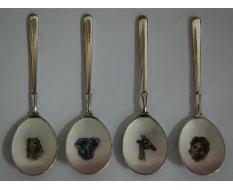 A set of four modern silver and enamel souvenir spoons, each bowl decorated in enamel with an african animal, Birmingham 1971