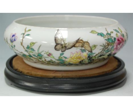 A Chinese stoneware shallow bowl enamel decorated with butterflies amongst foliage, six character mark verso Condition Report