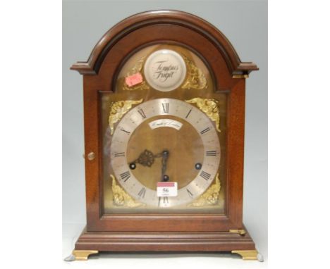 A modern mahogany cased bracket clock, having silvered chapter ring and Arabic numerals, signed Comitti of London, having Ger
