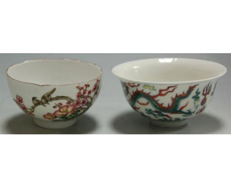 A Chinese porcelain tea bowl with dragon decoration, six character mark verso; and one other with six character mark verso an