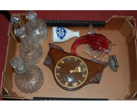Mixed lot to include 1930s oak cased mantel cloak, three glass decanters, blue & white jar, etc