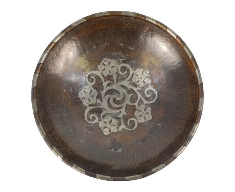 Hugh Wallis (British, 1871-1943) a copper shallow bowl with pewter decoration - raised on three button feet, signed with init