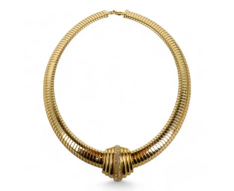 A vintage Christian Dior gilt necklace - of articulated 'snake' form and set with white stones to a stepped centre.