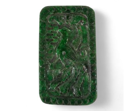 A 20th century Chinese carved jade panel - rectangular and decorated with an exotic bird and dragon on reverse, 9cm wide.