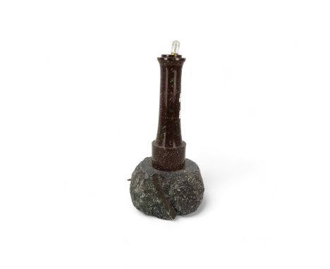 An early 20th century turned serpentine lighthouse - on a rocky base, lacking lantern, 41cm high.