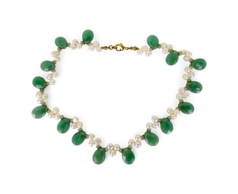 A pearl and jade necklace - the clusters of pearls interspersed between faceted jade drops.