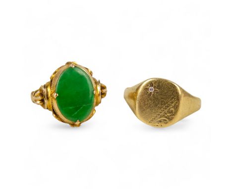 A yellow metal jade set ring - size N, weight 3.4g, together with another yellow metal ring, size R, weight 2.3g.