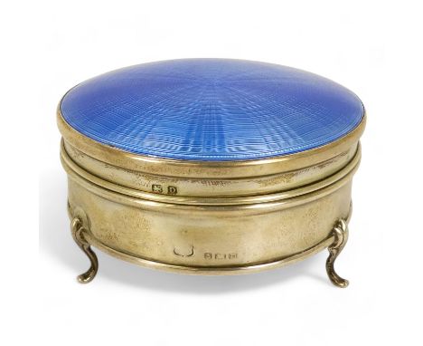 A silver and enamel trinket box - Birmingham 1928, circular with blue engine turned cover, raised on three cabriole legs, 8cm