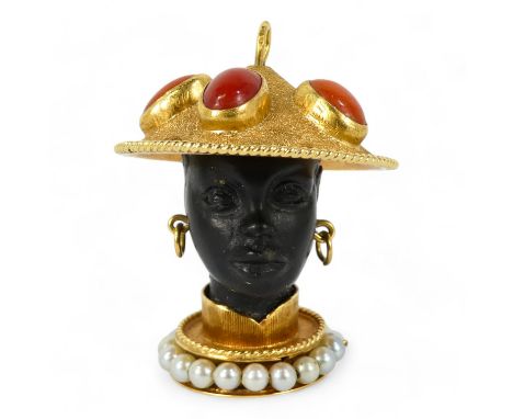 An 18ct gold pearl and coral set blackamoor pendant - modelled as an elegant Nubian figure wearing a sedge hat set with caboc